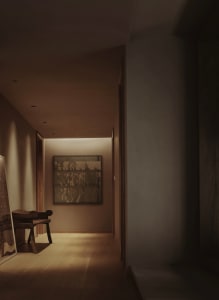 A modern corridor featuring wood plank flooring, soft lighting, and minimalist decor.