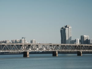 Modern bridge featuring metal construction spanning a body of water