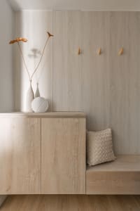 Modern entryway with a wooden cabinet and minimalist design