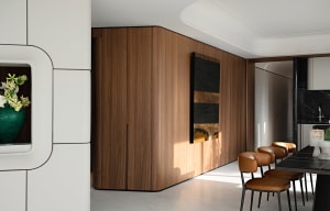 Modern residential kitchen featuring wooden cabinets and a contemporary design.
