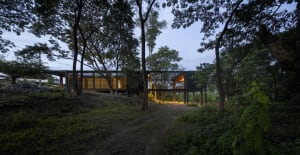 A modern house constructed with concrete exterior materials.