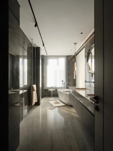 Contemporary bathroom featuring marble tiles and minimalist design elements.