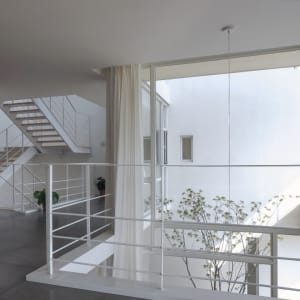 White interior staircase with modern design elements.