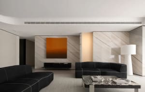 Cozy black sofa and marble coffee table in a modern design living room