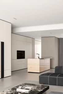 Modern minimalist kitchen design with marble countertops and wooden finishes