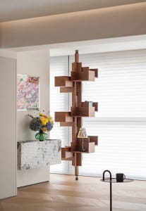 A modern industrial living room cabinet made of wood with a unique design.