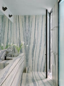 Modern bathroom with marble walls and floor, clean and clutter-free design.