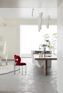 Modern kitchen interior with marble countertop and white appliances.