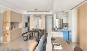 Modern interior design featuring minimalist kitchen with wood, marble, and stainless steel elements