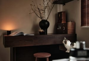 A modern living room with wooden walls and a comfortable seating area.
