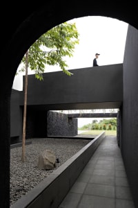A modern architectural space featuring concrete material and a minimalist design.