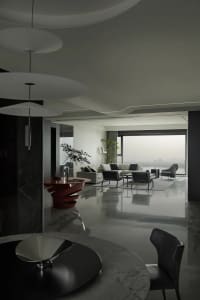 Modern minimalist living room featuring marble accents and a sleek, contemporary design.