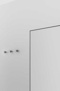 Modern, minimalist interior design featuring a glass panel wall.