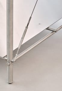 Modern metal table with structural components and cables