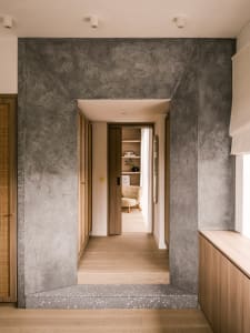 Modern residential interior with concrete walls and floor