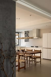 Modern minimalist kitchen featuring wood elements and minimalist design.