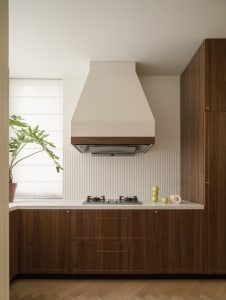 Modern kitchen featuring wooden cabinets with a sleek, clean design.