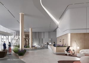 A modern lobby with concrete and steel materials and a welcoming area.