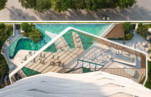 A modern pool deck with a wooden pergola and greenery.