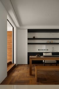 Modern residential interior with wooden flooring and minimalist design.