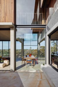 Modern residential space featuring concrete and glass materials.