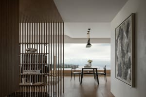 Modern interior design featuring a marble coffee table and gray sofas.