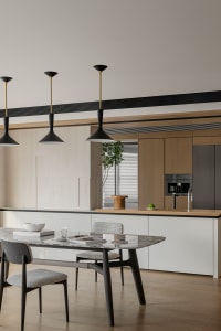 A sleek, modern kitchen featuring a marble countertop and wooden cabinetry.