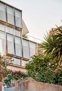 A modern house featuring large glass windows