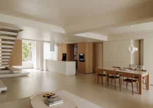 Modern kitchen and dining area with white and wooden furniture, minimalist design.