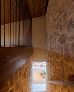 Modern interior space featuring textured concrete walls and minimalist design.