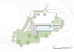 A modern house designed with glass, concrete, and metal materials