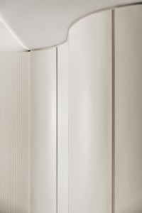 A photograph of modern interior design featuring matte-finished paper elements.