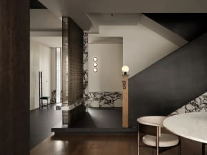 Modern interior living space with marble and concrete materials.