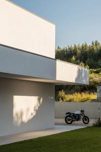 A minimalist exterior of a modern building with a concrete finish.