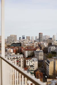 Aerial view of Paris with modern skyscrapers and traditional buildings.