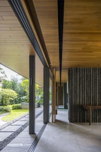 Modern entrance hall with natural stone and concrete materials