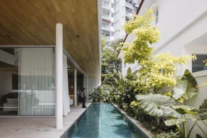 Modern residential architecture featuring glass and concrete materials.