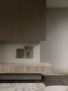 A minimalist interior design featuring a tiled counter surface.