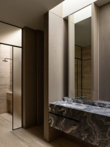 Modern bathroom with marble vanity and shower