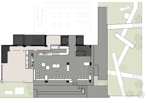 Modern office space with a concrete floor and open layout.