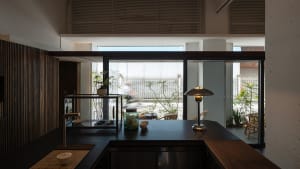 Modern home interior featuring a combination of glass, steel, and wood materials.