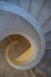 Industrial-style concrete staircase viewed from above.