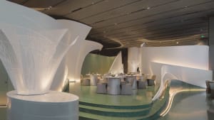 Modern restaurant with concrete walls and illuminated lighting features