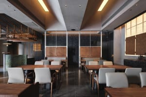 Modern industrial restaurant interior with marble accents and metallic finishes.