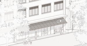 A black and white architectural drawing depicting a modern retail storefront with glass and concrete materials.