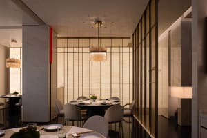 A modern minimalist restaurant interior with fabric curtains, metallic accents, and marble tables and chairs.