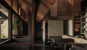 Interior of a restaurant featuring wood and concrete materials
