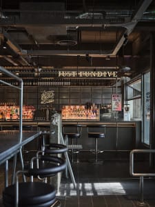 Industrial-style bar with metal and concrete materials