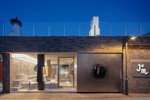 Modern storefront with metallic facade and glass doors