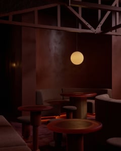 Circular tables and seating with modern interior design elements in a restaurant bar setting.